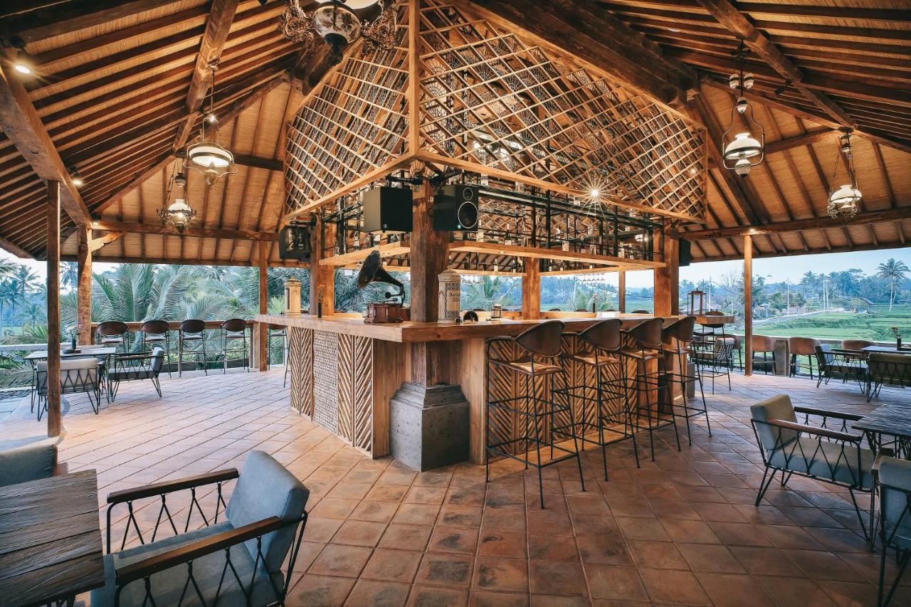 Kuwarasan A Pramana Experience Hotel Ubud Exterior foto The bar at the clubhouse